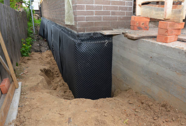 Happy homeowners after waterproofing job in Hamlin